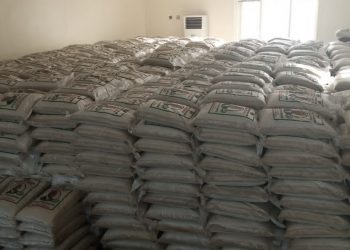 Riceman takes delivery of trailers of long grain rice to be shared during Christmas season